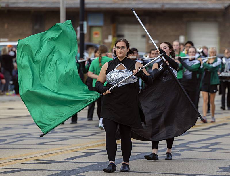 The Rock Falls color guard moves through the homecoming parade Thursday, Sept. 21, 2023.