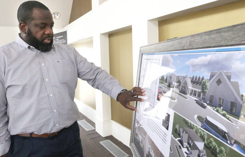 New Hope Missionary Baptist Church Pastor Joe Mitchell talks Friday, Feb. 24, 2023, at the church in DeKalb, about the plans for a community center addition at the church.