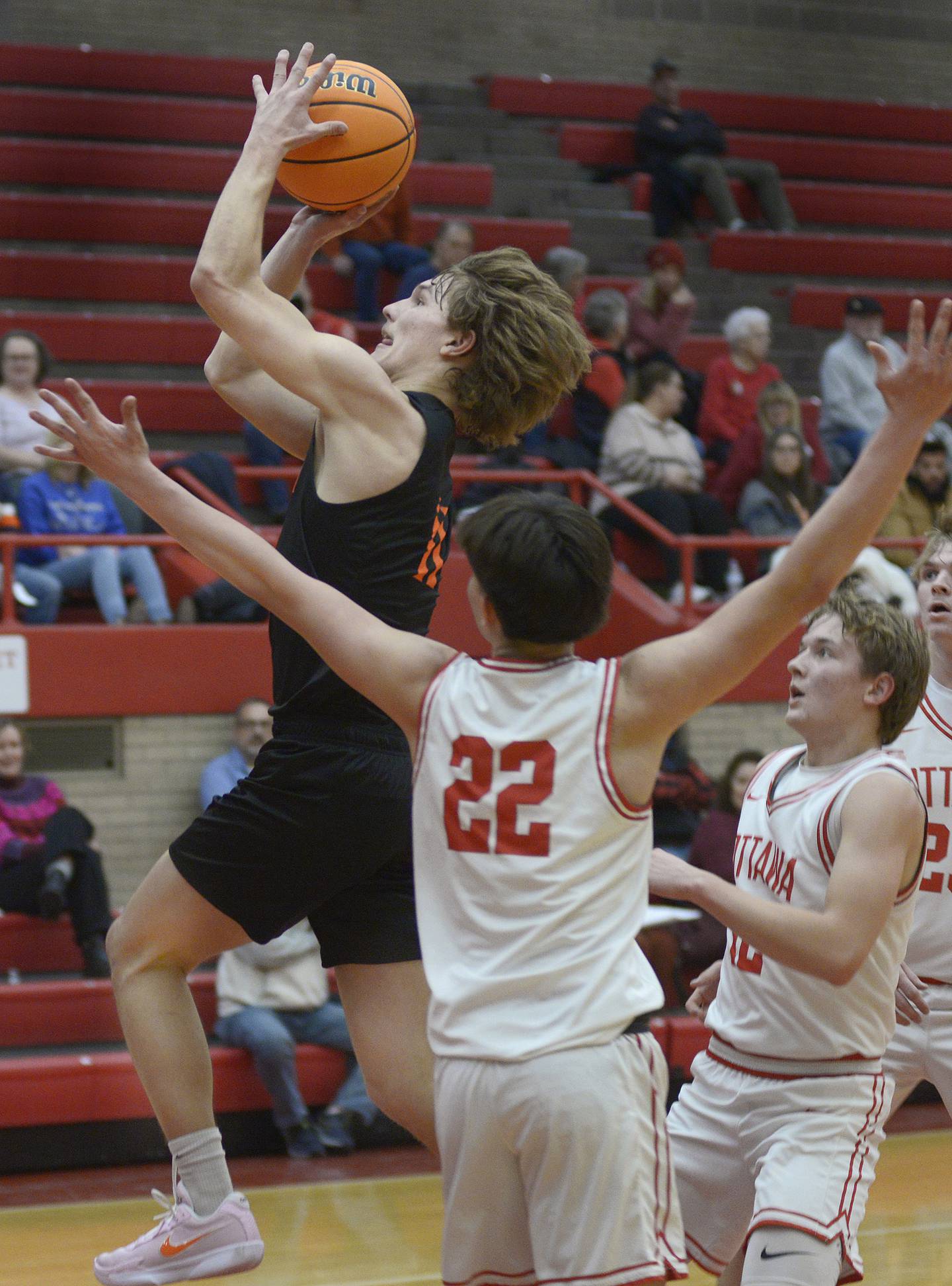 Sandwich’s Nick Michalek gets past Ottawa’s Dom Parks for a layup in the 2nd period Tuesday at Ottawa.