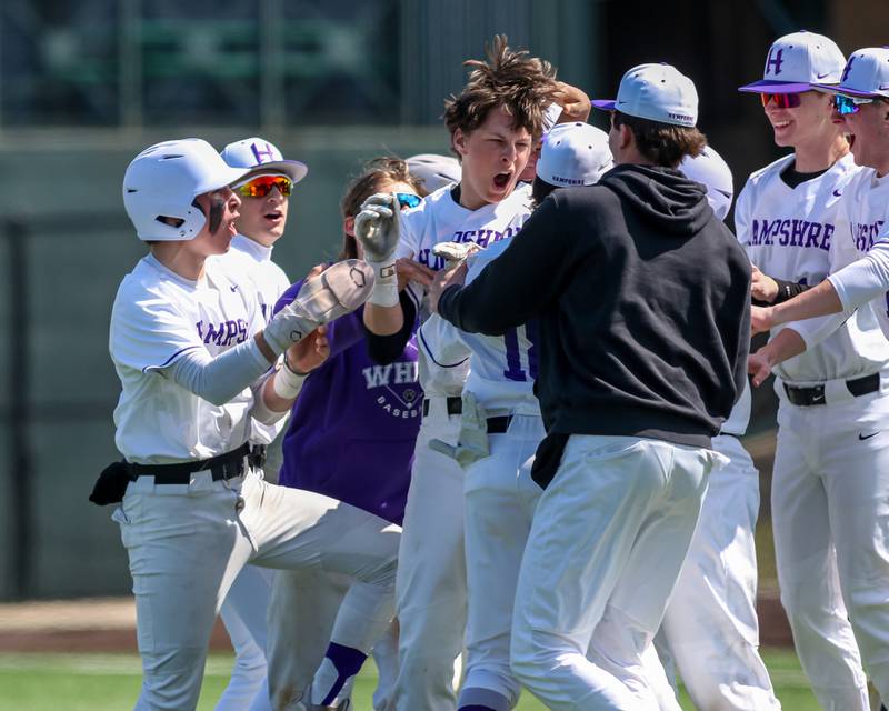 Hampshire's Ari Fivelson (3) celebrates the win with teammates during baseball game between Dixon at Hampshire.  March 28, 2024