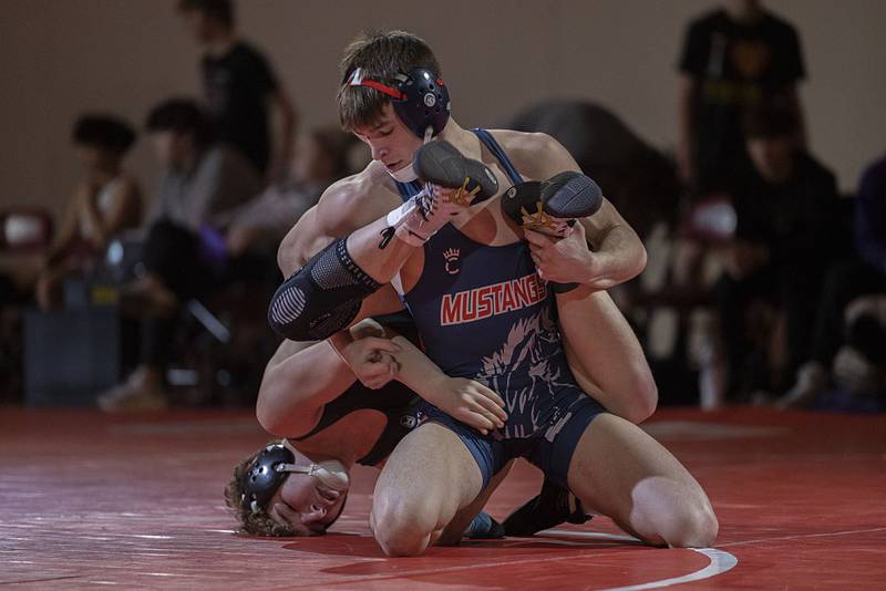 Morrison’s Caleb Modglin and Dixon’s Neomiah Holloway vie for the win in the 157 pound weight class in the Class 1A wrestling sectionals at Oregon.