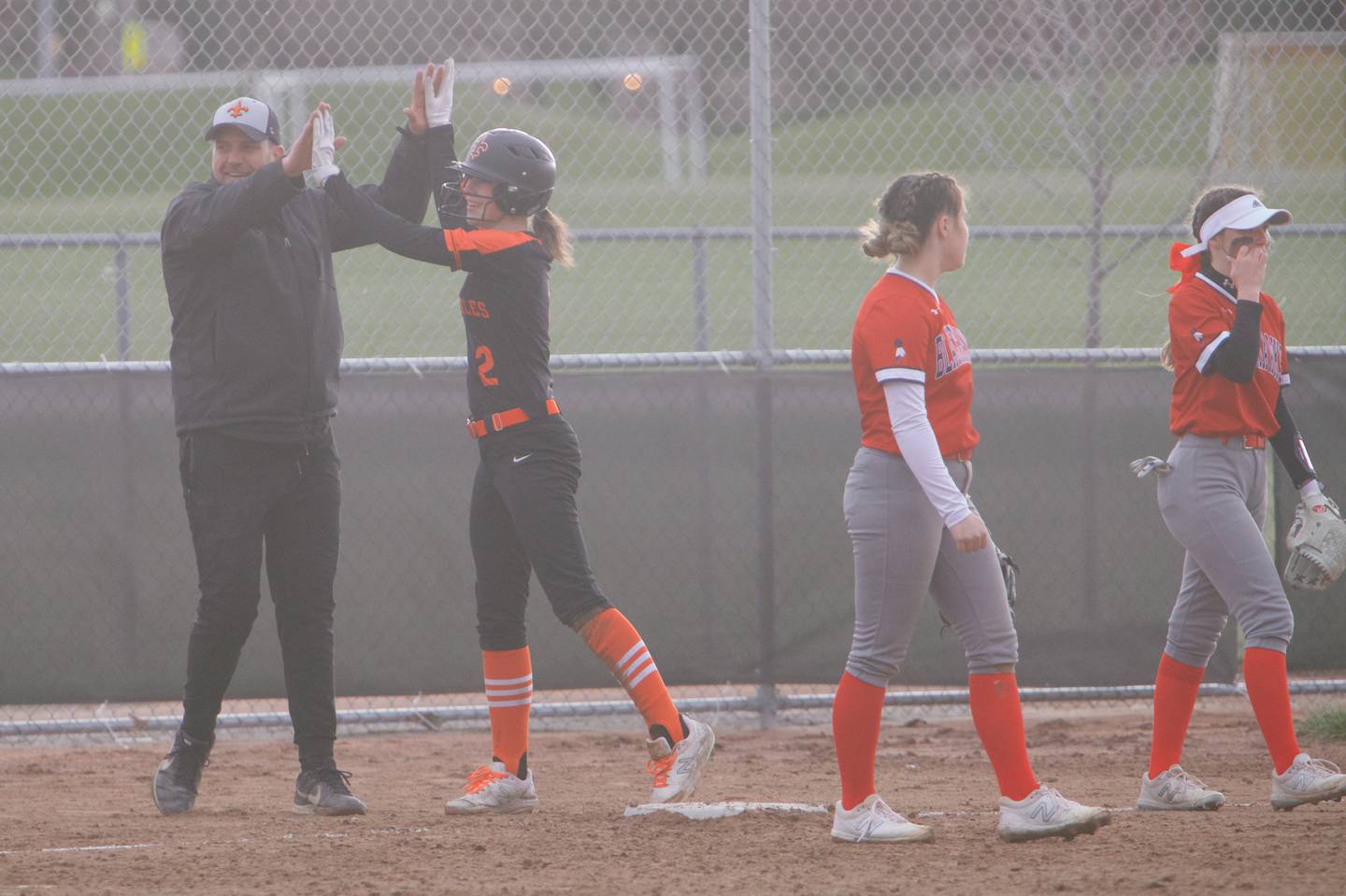 St. Charles East's Holly Smith celebrates driving in 2 runs against West Aurora on April 6,2022 in St. Charles.
