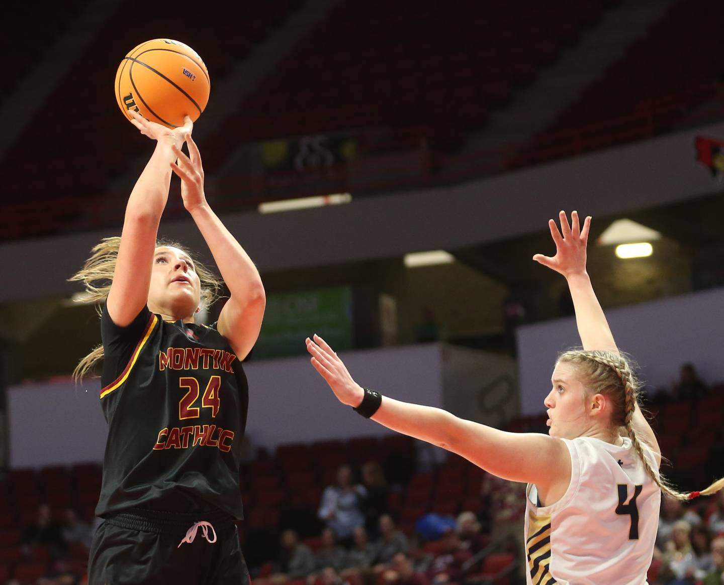 Montini's Peyton Farrell lets go of a jump shot over Quincy Notre Dame's Sage Stratton during a Class 3A state semifinal game on Thursday, March 6, 2025, at CEFCU Arena in Normal.