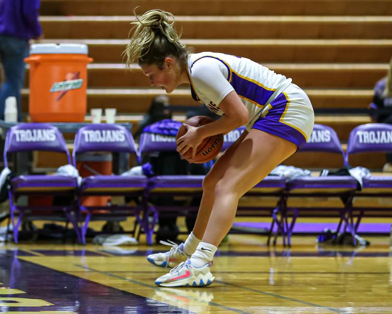 Downers Grove North's Lilly Boor (22) saves the ball from going out of bounds during girls basketball game between Downers Grove South at Downers Grove North. Dec 16, 2023.
