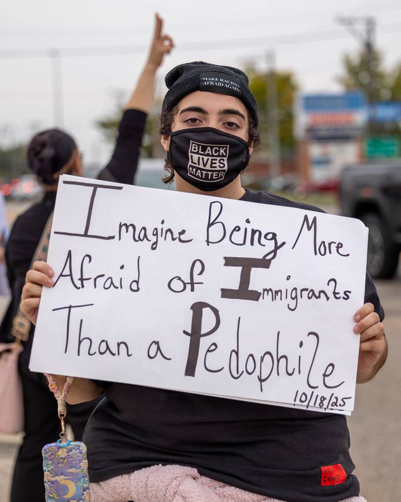 Protester holds sign at the ‘No Kings 2.0’ Protest on Saturday, October 18, 2025 on North Division Street in Morris.