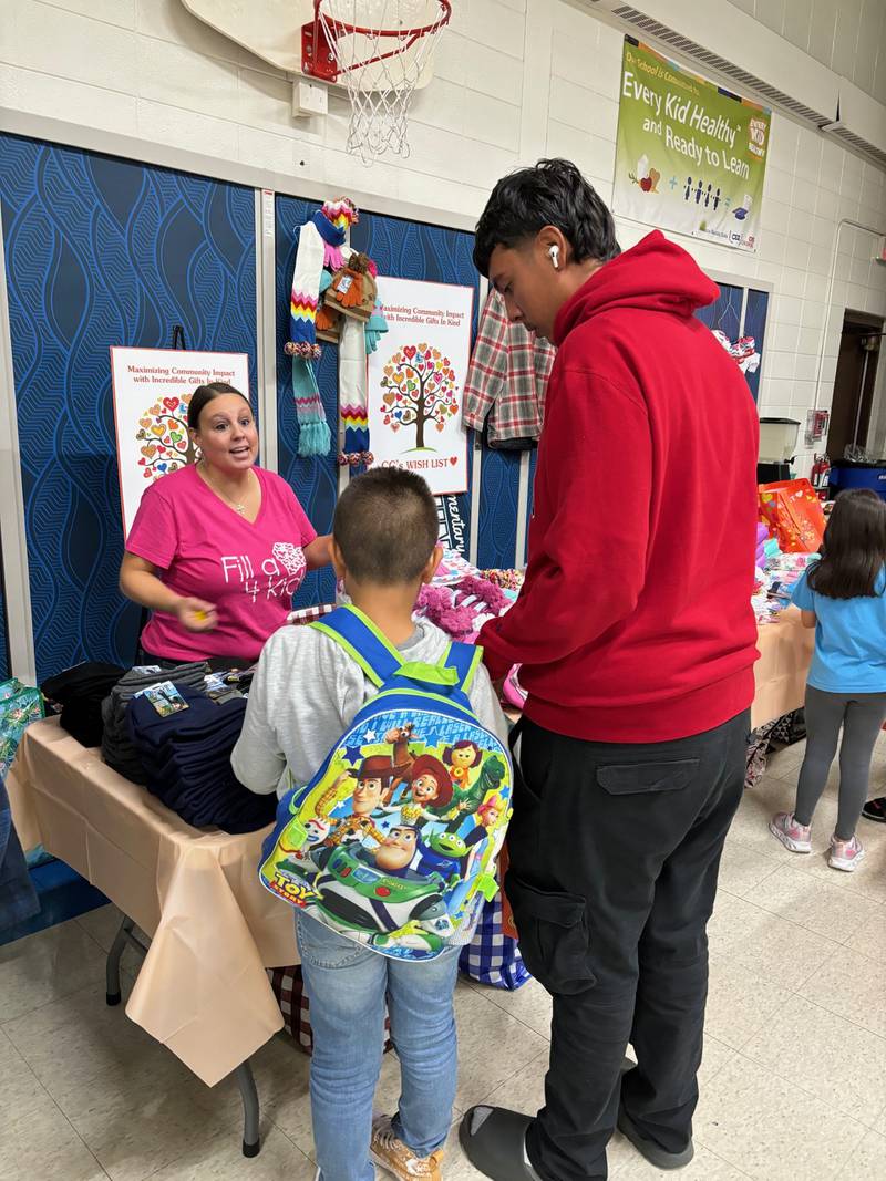 Held at Little Fort Elementary School, Waukegan, the two-hour event provided 150 deserving children with brand-new shoes, socks and clothing.  Fill a Heart 4 Kids brought an extra surprise with a bracelet-making station.