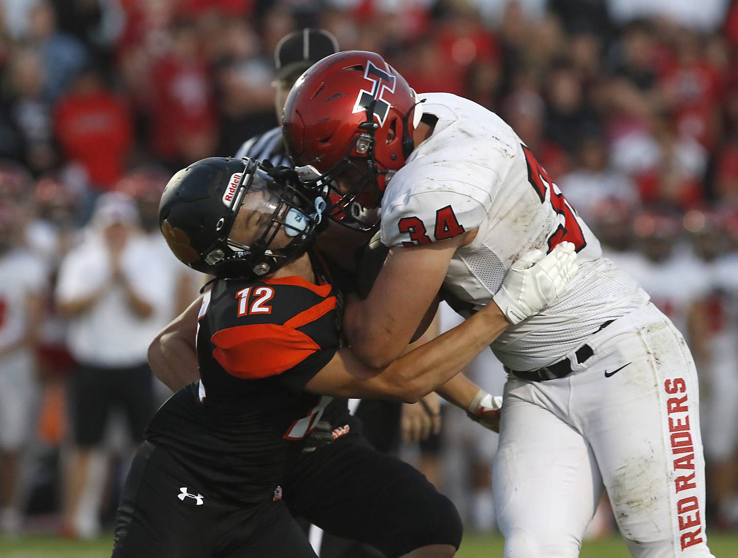 Crystal Lake Central's Rene Gaunaurd tries to tackle Huntley's Haiden Janke during a Fox Valley Conference football game Friday, Aug. 26, 2022, between Crystal Lake Central and Huntley at Crystal Lake Central High School.