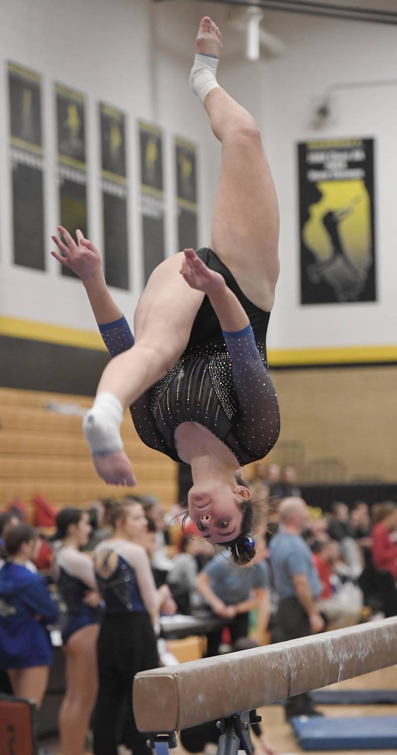 Geneva's Sadie Karlson on the balance beam at the Hinsdale South girls gymnastics sectional meet in Darien on Tuesday, February 7, 2023.