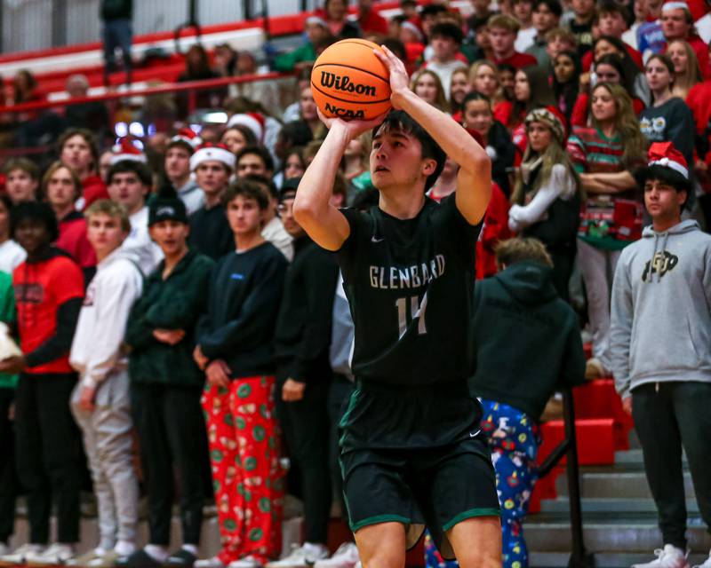 Glenbard West's Julian Yeh (14) squares up for a jumper during their basketball game between Glenbard West at Hinsdale Central, Friday  Dec 6, 2024  in Hinsdale.
