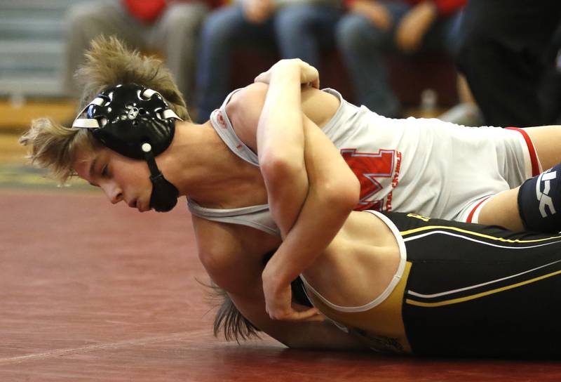 Marian Central Austin Hagevold tries to pin Harvard’s Owen Vail their 106-pound championship wrestling match in the IHSA 1A Richmond-Burton Wrestling Regional Thursday, Jan. 19, 2023, at Richmond-Burton High School in Richmond.