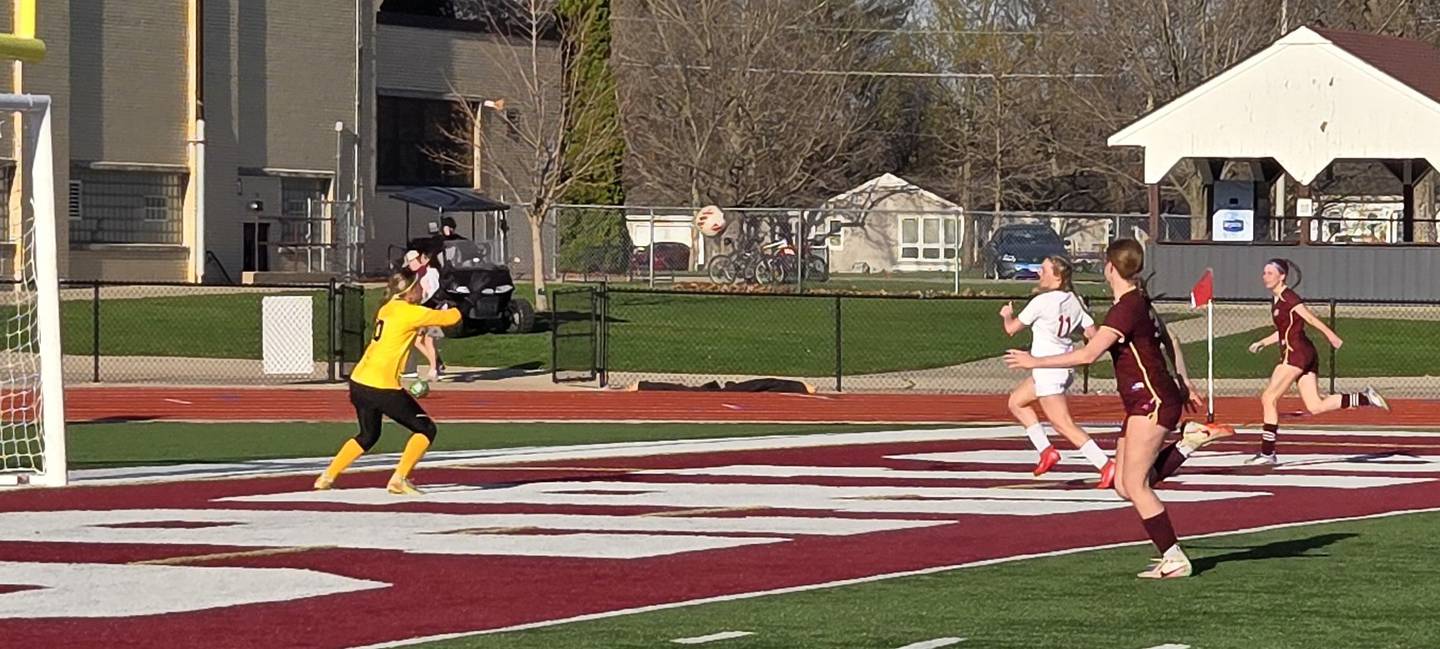 Ottawa keeper Shaelyn Miller prepares to stop a shot from Morris's Leah Martin in the second half of Wednesday's Interstate 8 Conference match at Morris.