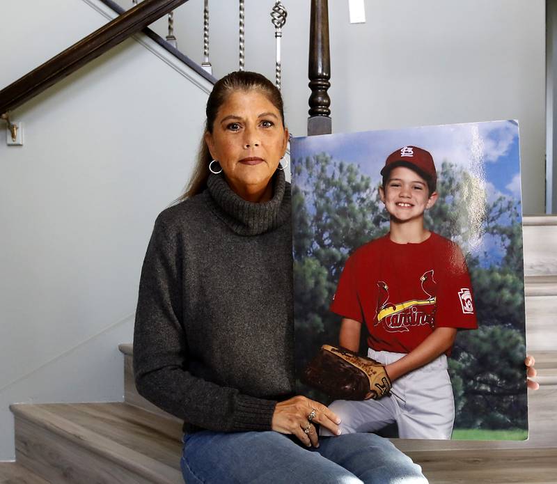 Margaret Borcia, holds a photograph of her son, Tony. who was killed by an intoxicated boater in 2012, on the Chain of Lakes . She now works in McHenry County courthouse and other courthouses as a victim advocate for AAIM.