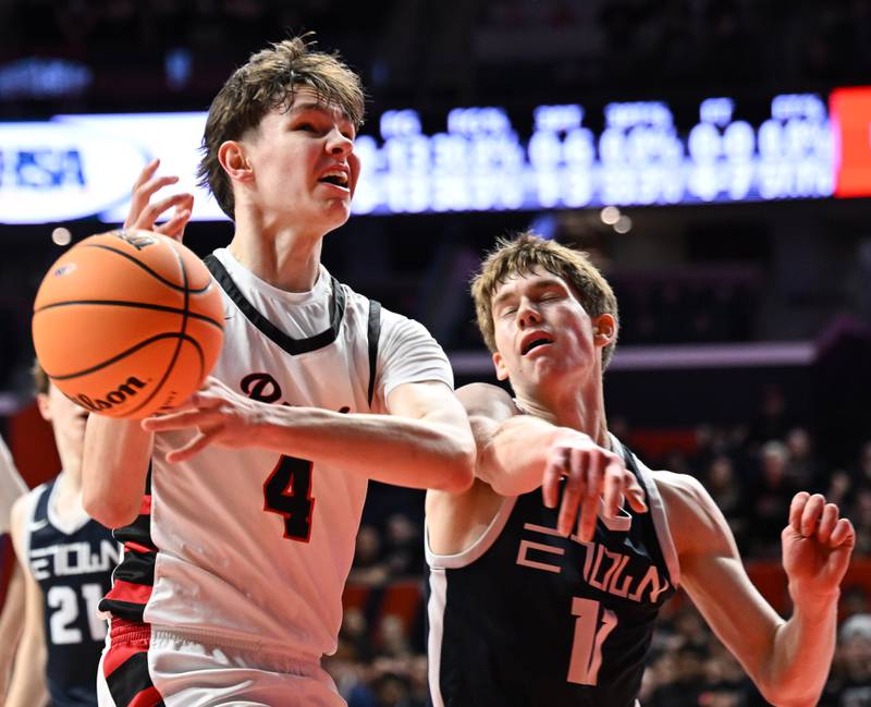 The ball pops loose from Benet Academy's Daniel Pauliukonis as he tries to get past Evanston's Theo Rocca during the IHSA Class 4A boys basketball state semifinals at State Farm Center on Friday, March 14, 2025 in Champaign.