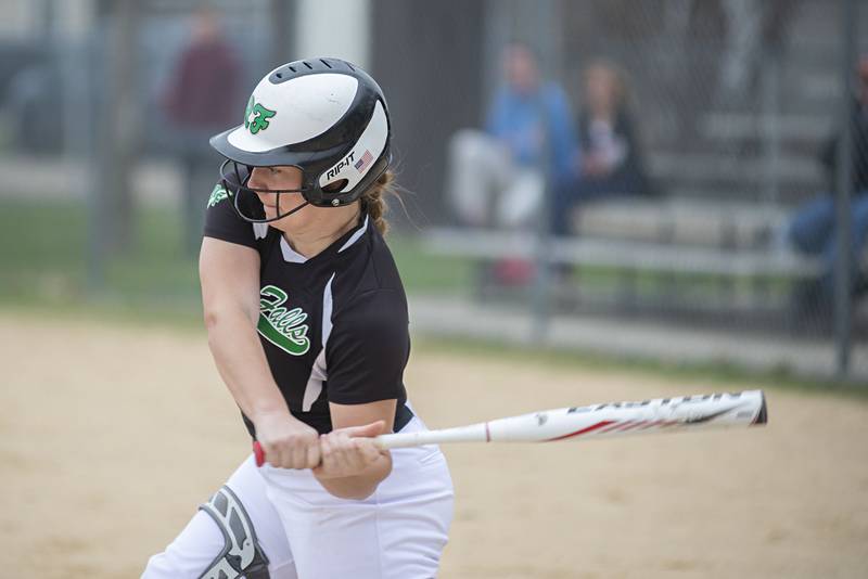 Rock Falls' Katie Thatcher connects for a hit to drive in a run against Dixon Tuesday, April 12, 2022.