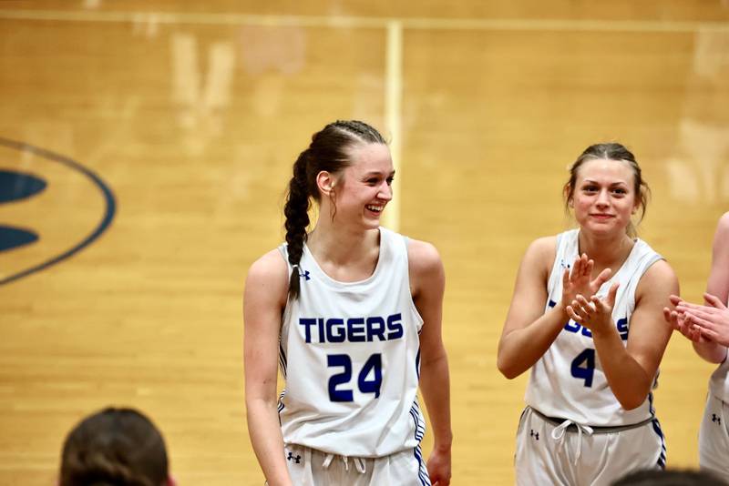 Madie Gibson (right) leads the cheer for teammate Keighley Davis after she became Princeton's all-time leading scorer, boys or girls, Monday night at Prouty Gym.