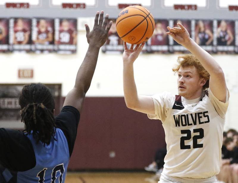 Prairie Ridge's Johnny Kemp shoots the ball over Illinois Math & Science Academy's Benjamin Dixson during a IHSA Class 3A Burlington Central Regional quarterfinal boys basketball game on Monday, feb23, 20256, at Prairie Ridge High School in Crystal Lake.