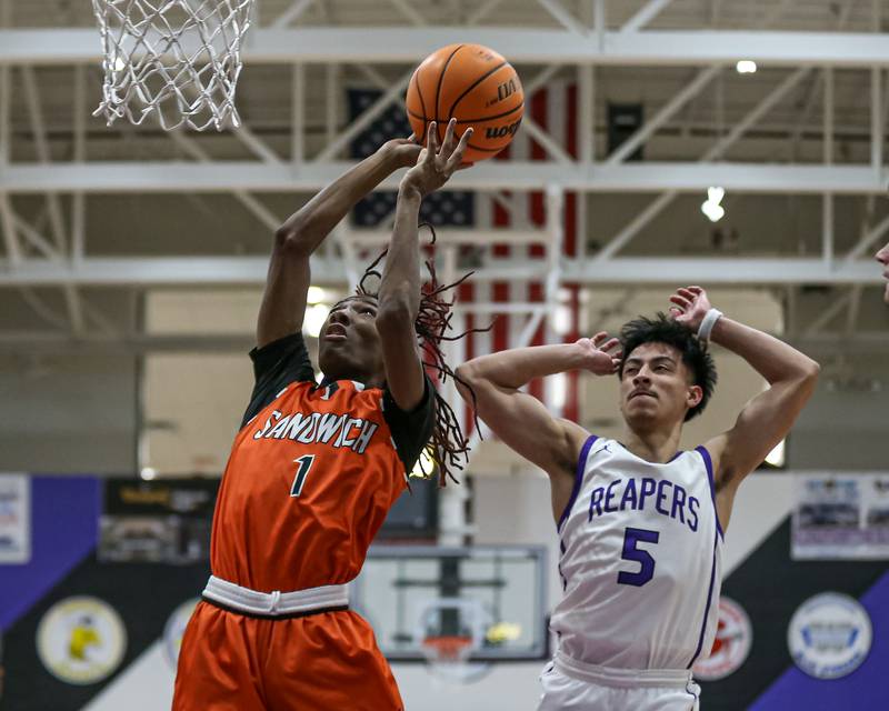 Sandwich's Simeion Harris (1) puts in a layup during their basketball game between Sandwich at Plano. Jan 27, 2025 in Plano.