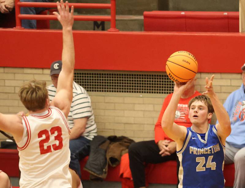 Princeton's Ryan Jagers shoots a jump shot over Ottawa's Owen Sanders during the Dean Riley Shootin' The Rock Thanksgiving Tournament on Monday Nov. 24, 2025 in Kingman Gymnasium at Ottawa High School.