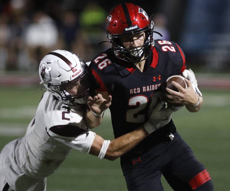 Prairie Ridge's Logan Thennes tackles Huntley's Chase Hojnacki during a Fox Valley Conference football game on Friday, Oct. 3, 2025, at Huntley High School.