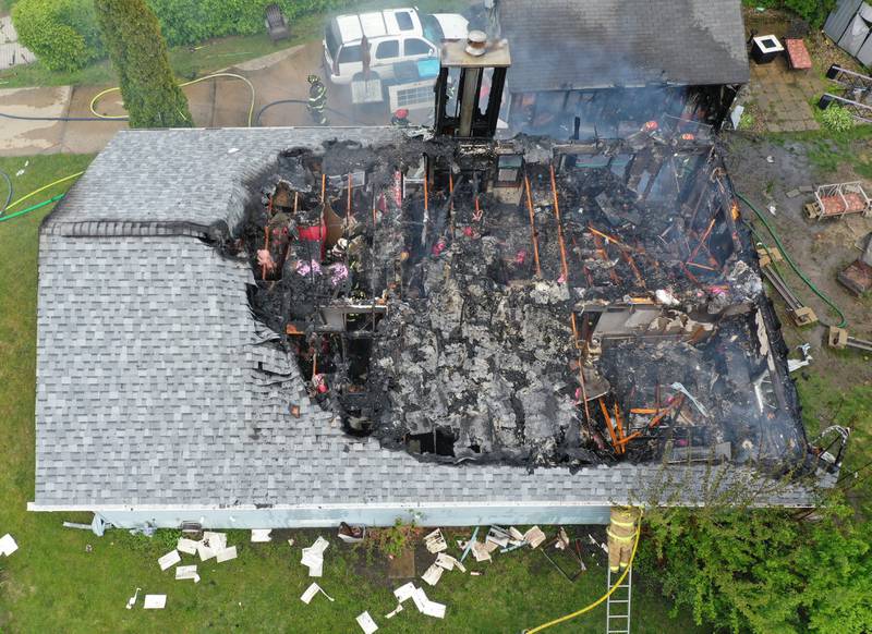 Firefighters work the scene of a structure fire in the 1900 block of Main Street on Monday, May 4, 2026 in Peru.