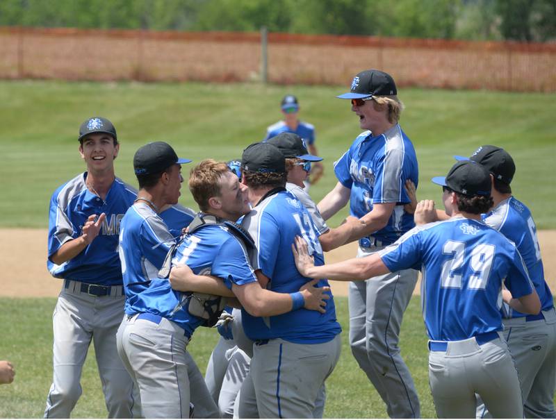 Newman players celebrate after recording the final out against Dakota to win the 1A Pearl City Sectional 10-7 on Saturday, May 27.