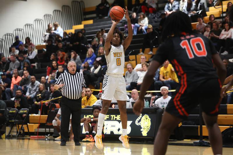 Joliet West’s Aamir Shannon takes the three point shot against Plainfield East on Friday, Dec. 8th, 2023 in Joliet.