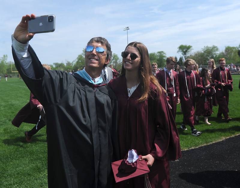 Teacher Steve Karlblom takes a selfie of him and his daughter, Karsen Karlblom, after she graduated Saturday, May 14, 2022, during the graduation ceremony at Prairie Ridge High School.