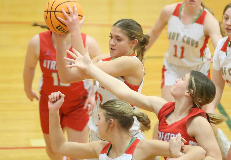 L-P's Phoebe Shetterly grabs a rebound over Streator's Reah Huey as teammate Kelsey Frederick boxes her out on Tuesday, Jan. 28, 2025 in Sellett Gymnasium at L-P High School.
