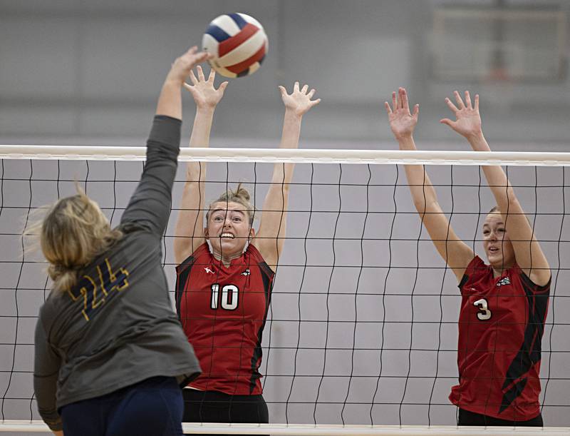 Fulton’s Reese Dykstra (left) and Annaka Hackett work against Sterling Saturday, Sept. 30, 2023 during the Sterling Volleyball Invitational held at Challand Middle School.