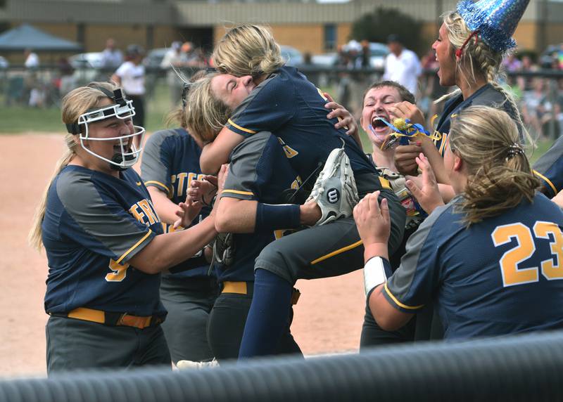 Sterling players gather in celebration around pitcher Elizabeth Palumbo after defeating Antioch in Monday's IHSA Class 3A supersectional softball game in Maple Park.