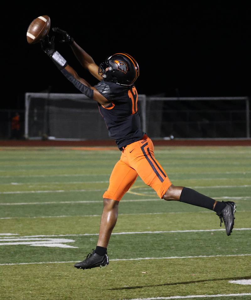 DeKalb's Derrion Straughter tries to pull in the high throw during their game against Stagg Friday, Oct. 25, 2024, at DeKalb High School.