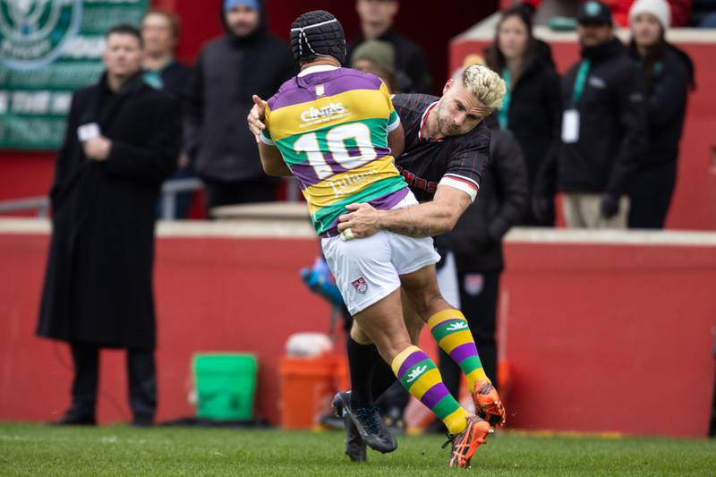 Chicago Hounds' winger Julian Domínquez wraps up New Orleans Gold's fly-half Esekia Iona (10) during a MLR match at Seat Geek Stadium in Bridgeview, on Sunday April 23, 2023.