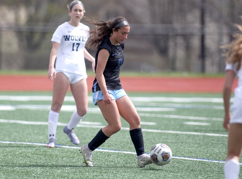 St. Charles North’s Bella Najera dribbles the ball during a Naperville Invitational game against Oswego East at Naperville Central on Saturday, April 23, 2022.