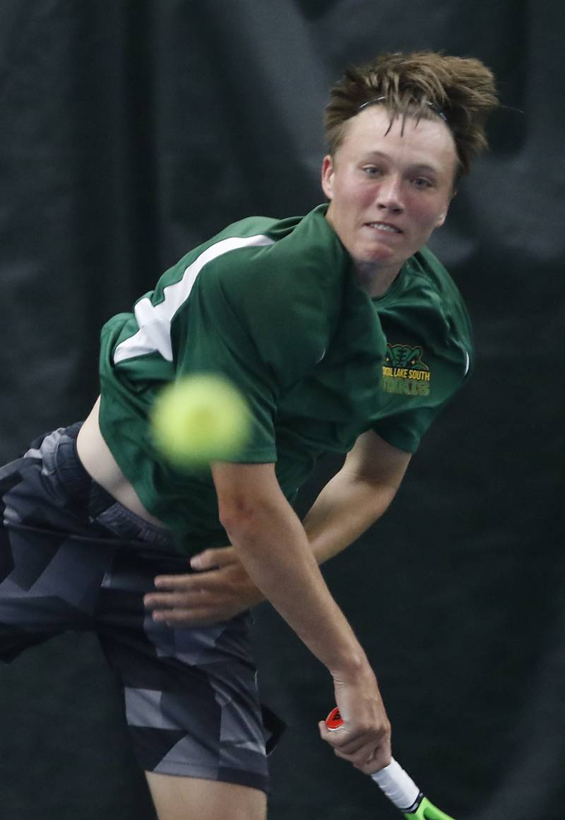 Crystal Lake South’s Jackson Schuetzle serves the ball during his IHSA 1A boys single tennis match against Alton Marguette’s  Stetson Isringhausen Thursday, May 26, 2022, at Heritage Tennis Club in Arlington Heights.