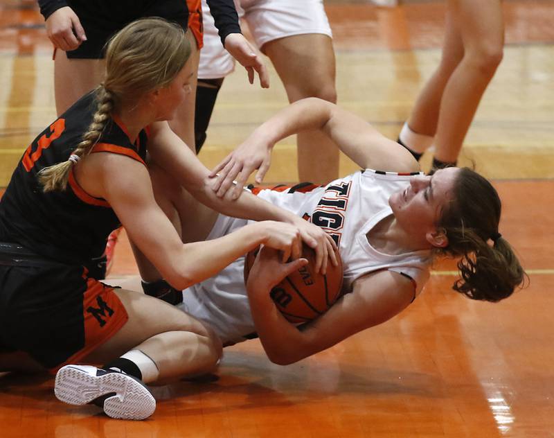 McHenry's Peyton Stinger battles for a loose ball with Crystal Lake Central's Kathryn Hamill during a Fox Valley Conference girls basketball game Tuesday, Nov.. 29, 2022, between Crystal Lake Central and McHenry at Crystal Lake Central High School.