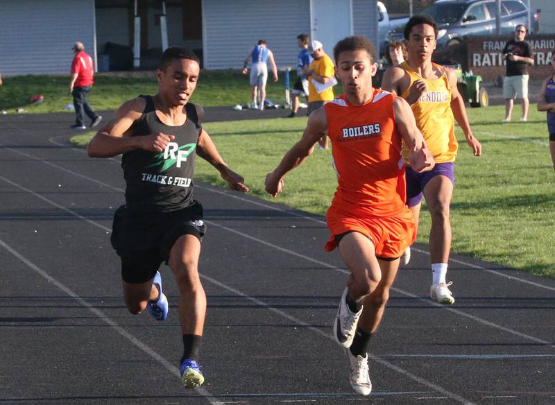 Rock Falls's Derek Prieto, Kewanee's Tre Amos and Mendota's Jayden Lesley compete in the 100 meter dash during the Ferris Invitational on Monday, April 15, 2024 at Princeton High School.