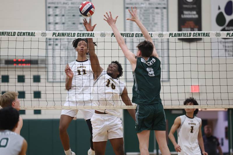 Joliet West’s Drew Johnson (11) watches as Alexander Ogugua (16) flips over a shot against Plainfield Central on Tuesday, April 23, 2024 in Plainfield.