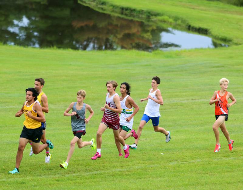 Boys compete in the varsity race during the McHenry County Cross Country Meet at Emricson park in Woodstock on Saturday, August 30, 2025.