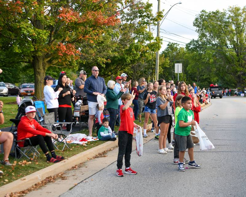 Young parade attendees excitedly wait for candy to be handed out during the Yorkville homecoming parade held on Thursday, Sept. 28, 2023.