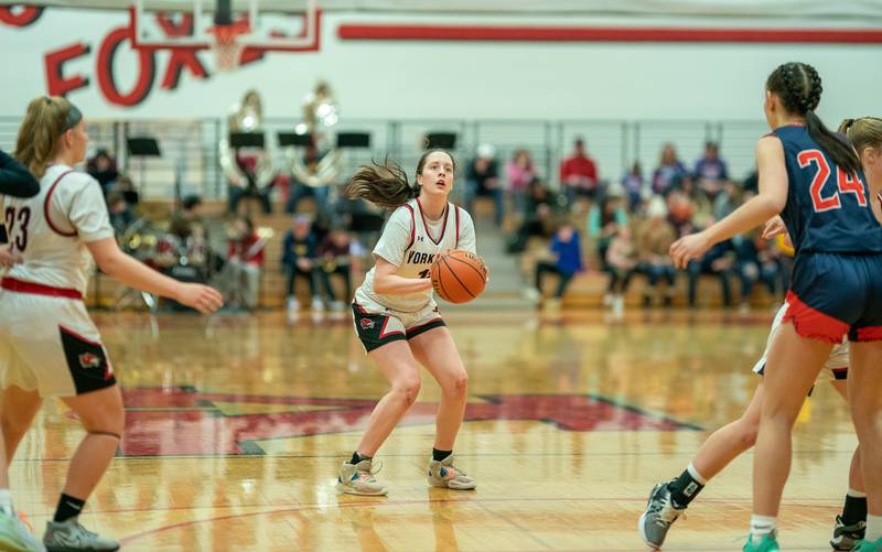 Yorkville's Brooke Spychalksi (11) spots up for a three-pointer against Oswego during the 13th annual Hoops 4 Hope Communities vs. Cancer basketball event at Yorkville High School on Saturday, Jan 28, 2023.