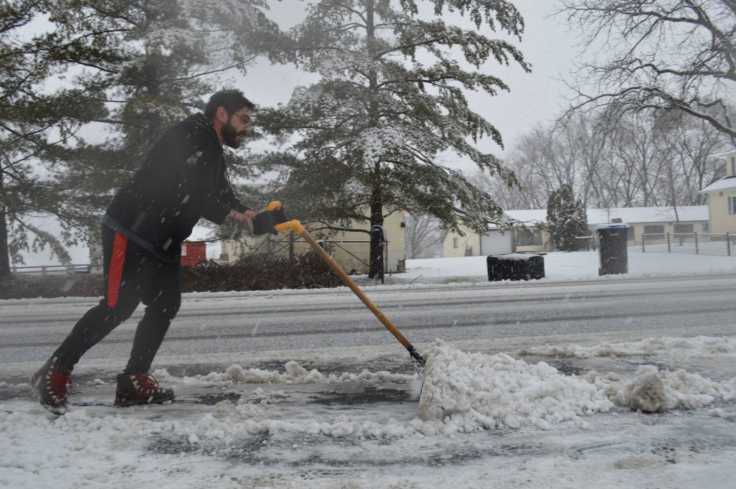 Ron Morley of McCullom Lake shovels his driveway Tuesday, Dec. 28, 2021, the new National Weather Service record for the latest measurable snowfall in Northern Illinois.