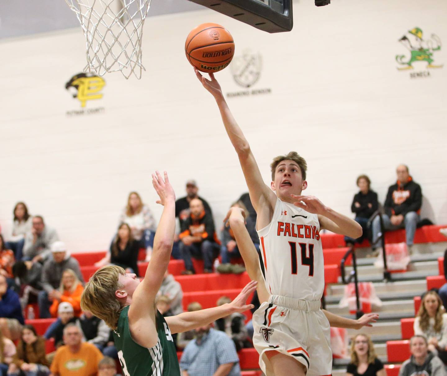 Flanagan-Cornell's Seth Jones (14) sends the ball into the net with this drive to the basket as St. Bede's Callan Hueneburg (3) defends during the Route 17 Thanksgiving Classic on Tuesday, Nov. 22, 2022, at Woodland School.