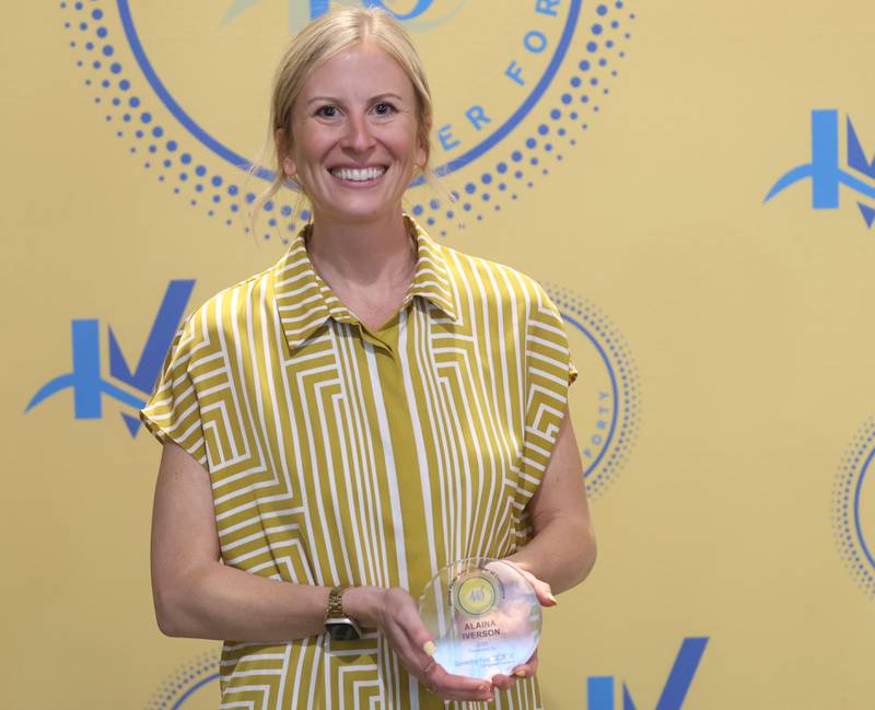 Alaina Iverson poses with her 40 Under Forty award during the Illinois Valley Chamber of Commerce Champions of Change Awards Night on Wednesday, May 6, 2026 at the Westclox Event Center in Peru.