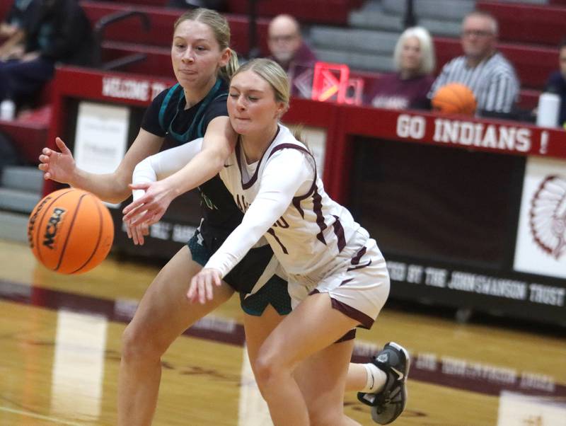 Marengo’s Myah Broughton, right, battles Woodstock North’s Abigail Ward in varsity girls basketball on Tuesday, Dec. 2, 2025, at Marengo High School in Marengo.