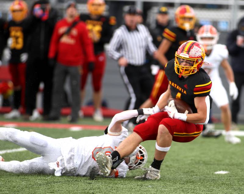 Batavia’s Charlie Whelpley is taken down by a Hersey player during their Class 7A second-round playoff game in Batavia on Saturday, Nov. 5, 2022.