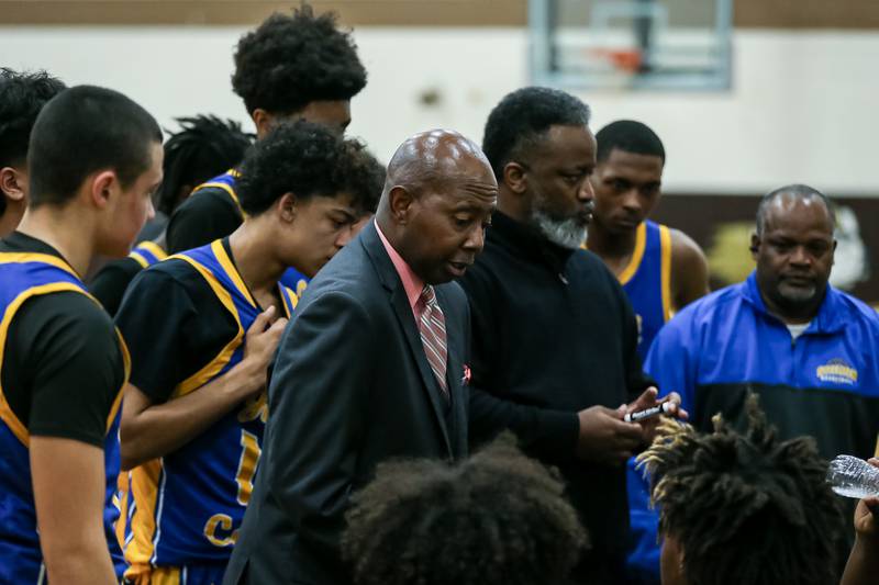 Joliet Central's head coach Lawrence Thompson instructs the team during a timeout in the WJOL Tournament Championship game. Nov 25, 2023.