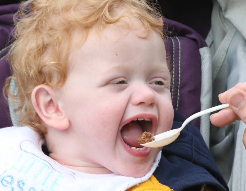 Reese Post of Crystal Lake tries his first bite of Burgoo during the 53rd annual Burgoo on Sunday, Oct. 8, 2023 downtown Utica.