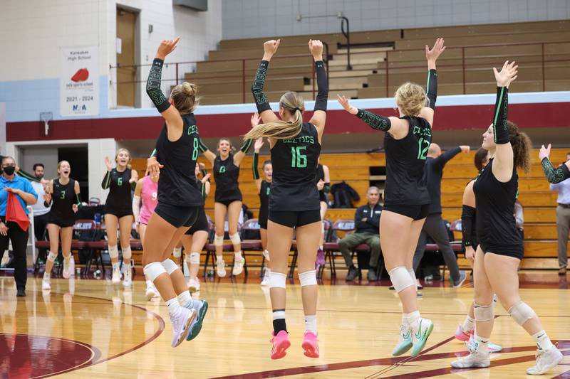 Providence players leap in celebration as they're awarded the final game point during the Celtics' victory in two sets, 25-25, 25-18, over Lemont in the IHSA Class 3A Kankakee Sectional championship on Thursday, Nov. 6, 2025.