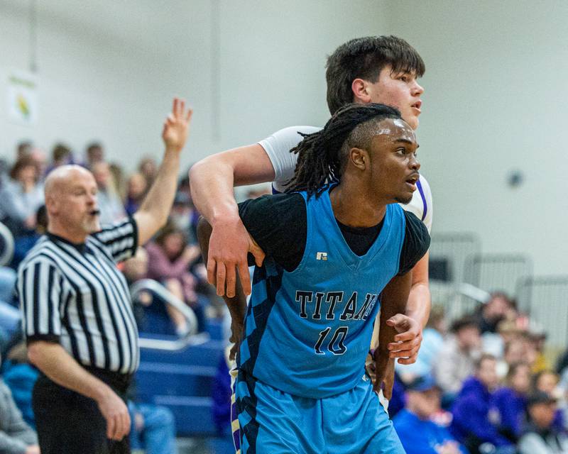 Official signals a made 3-point field-goal by Serena's Cash Raikes (30) as he watches shot fall into basket whilst being boxed out by Benjamin Dixson (10) of IMSA in the quarterfinals of the Little Ten Conference Tournament on Monday, Feb. 2, 2026 at Somonauk High School in Somonauk.