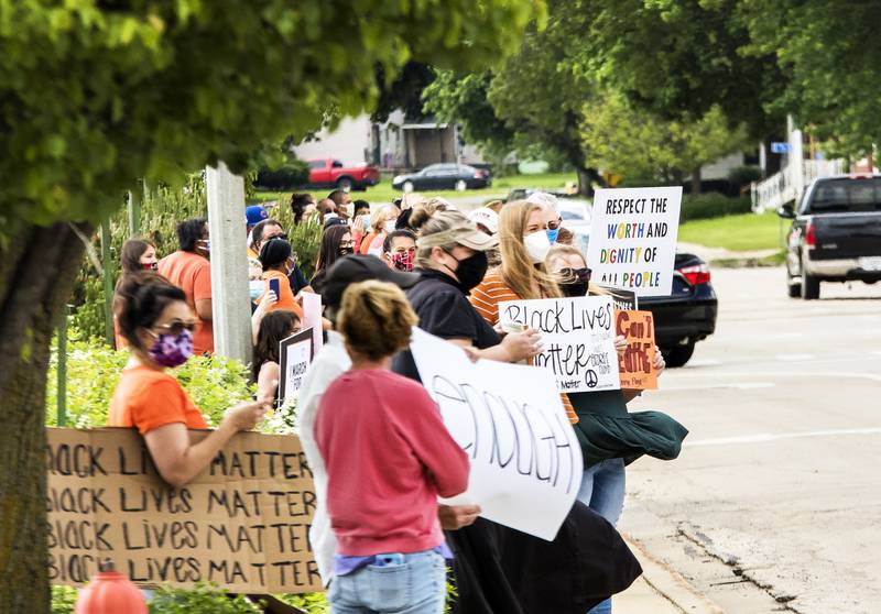 Participates lined both side of First Avenue near the YWCA in Sterling during a black lives matter protest in memory of George Floyd May 29. Motorist drove past with some honking horns during the protest Friday evening.